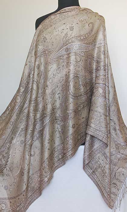 This is an elegant, light weight shawl with a jacquard woven, jamavar 